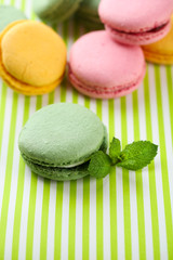 Gentle macaroons on table close-up