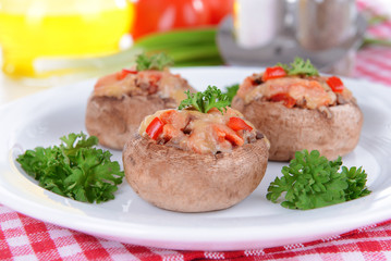 Stuffed mushrooms on plate on table close-up