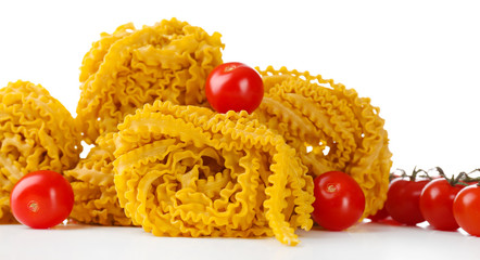 Raw homemade pasta and tomatoes, isolated on white