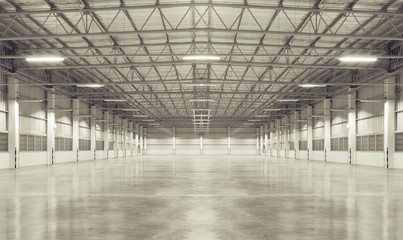 Concrete floor inside industrial building. Use as large factory, warehouse, storehouse, hangar or plant. Modern interior with metal wall and steel structure with empty space for industry background.