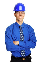 Young smiling businessman in a protective helmet