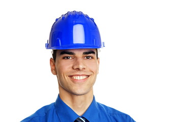 Portrait of young smiling businessman in a protective helmet