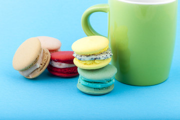 Sweet and colorful French macaroons on pastel background