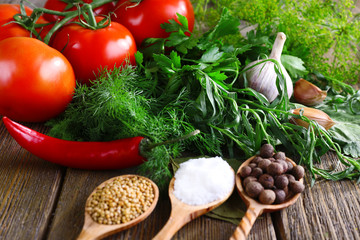 Fresh vegetables with herbs and spices on table, close-up