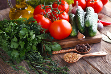 Fresh vegetables with herbs and spices on table, close-up