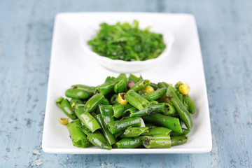 Salad with green beans and corn with sauce