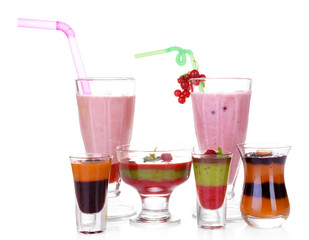 Glasses of tasty smoothies and milk shake, isolated on white