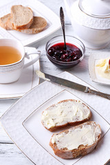 Fresh bread with cherry jam and homemade butter