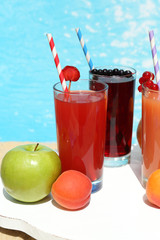 Delicious cocktails on beach, close-up