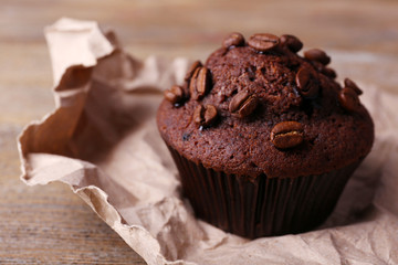 Chocolate muffin and coffee grains