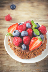 chocolate cake with raspberries, blueberries and strawberries
