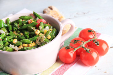 Salad with green beans, ham and  corn in bowl,