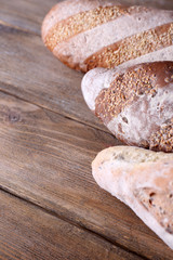 Fresh bread on wooden background