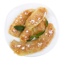 Sweetened fried banana on plate, isolated on white