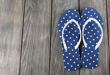 Color flip-flops on wooden background