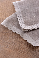 Napkin on wooden table, close-up