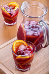 ice refreshing summer drink with lots of different fruits