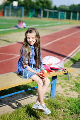 Portrait of beauty pre-teen tween kid girl on the soccer field