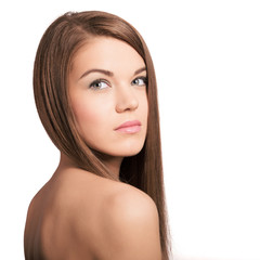 Fototapeta premium Cute young woman with long healthy brown hair. Natural look.