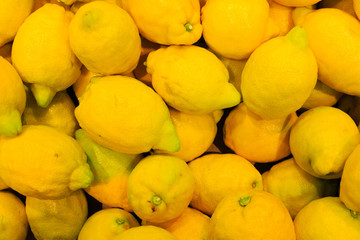 food background. closeup on tropical fruits lemons.