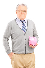 Vertical shot of a mature man holding a piggybank