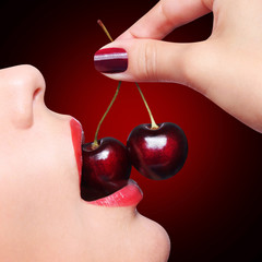 Sexy Red Lips with Cherry over black background