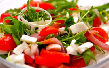 Mediterranean salad with feta cheese, tomato and rucola