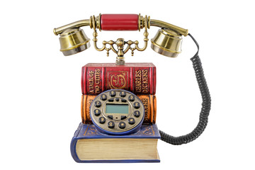Phone stylized under a pile of books