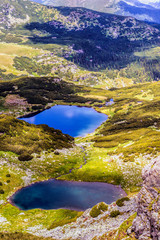 Fototapeta na wymiar Landscape with a glacial lake in the highlands of Fagaras mounta