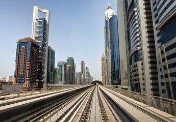 Dubai metro tracks with skyline