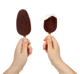 Two female hands holding two ice cream