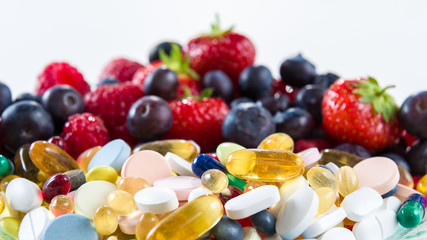 Fototapeta na wymiar Healthy lifestyle, Fruit and pills, vitamin supplements