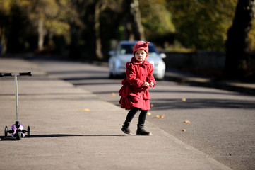 Girl with a scooter