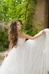 Beautiful bride girl walking at wedding day, happy woman in blow