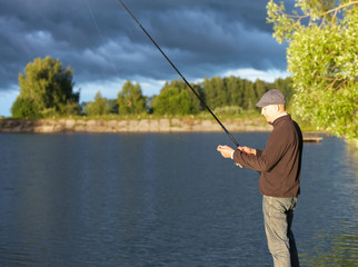  man fishing in a pond