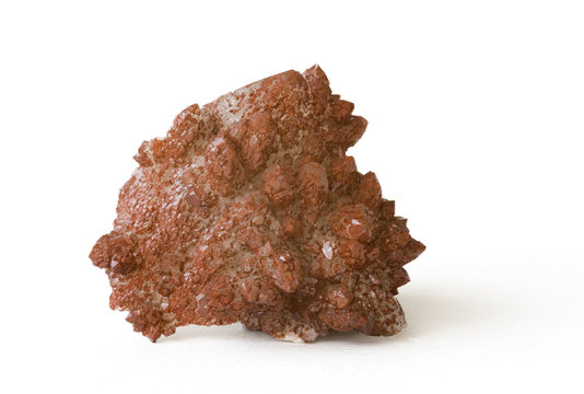 Quartz covered with a layer of red iron oxide. 5cm high.