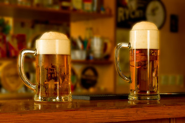 Two pitchers of beer.