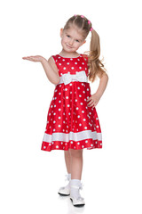 Smiling little girl makes a hand gesture