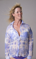 Portrait of a mature woman with hair blowing