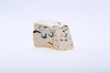 piece of blue cheese on white background
