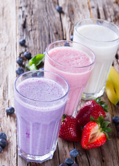 Fresh fruits milk shake on wood