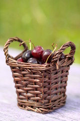 Cheries in brown basket outdoor