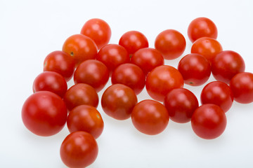 Fresh ripe cherry tomatoes isolated on a white background