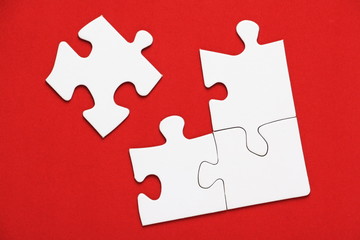 Blank Jigsaw pieces on a bright red background