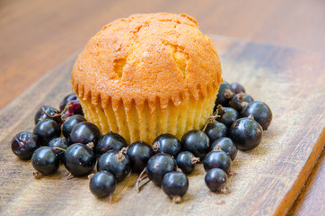 a lemon muffin with blackcurrant