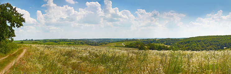 Hilly rural panoramic landscape. Summer, Ukraine.