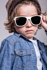 Boy wearing white sunglasses