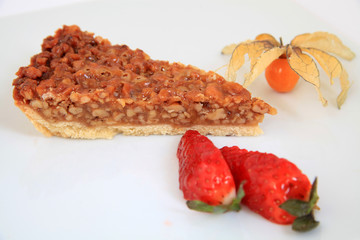 A slice of pecan pie with decoration