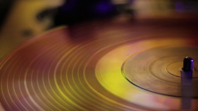 LP rotating disc in yellow and gold tones.