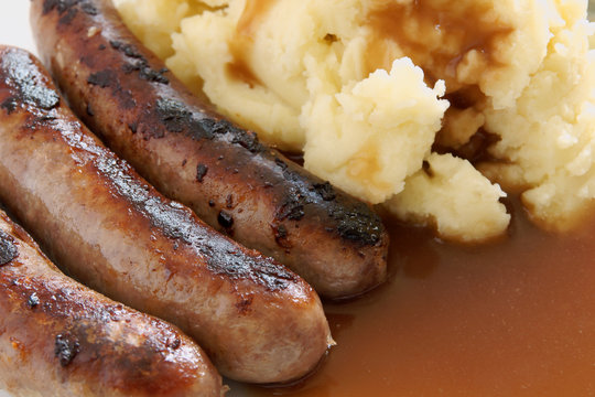Bangers and Mash and traditional British meal of sausages with mashed potatoes and gravy